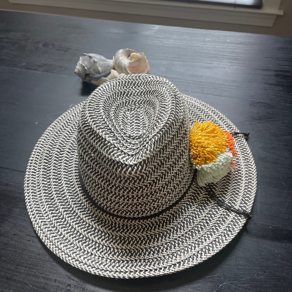 Stylish Black and White Woven Hat with Floral Accent